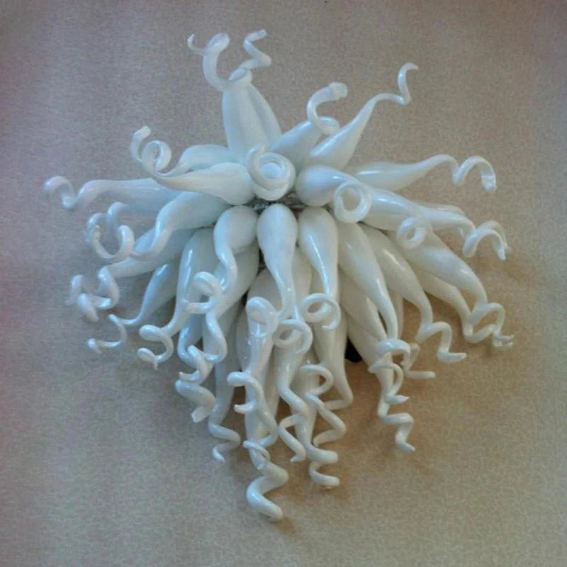 Pure white frosted glass wall sconce with a soft, ethereal light distribution for luxury bedrooms.