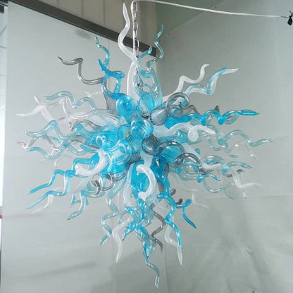 High-angle shot of the hand-blown artistic ceiling light installation, highlighting its dense and colorful glass structure.