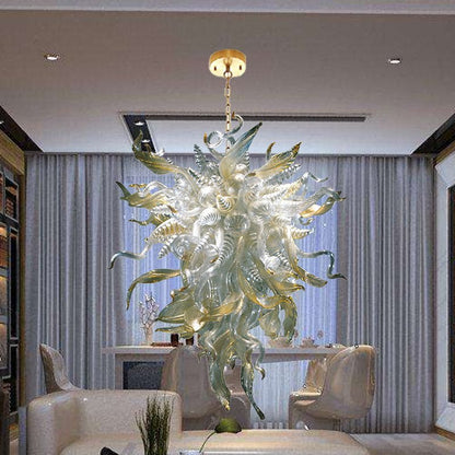 Sophisticated modern dining room interior featuring a large gold-accented glass chandelier as a luxurious central focal point.