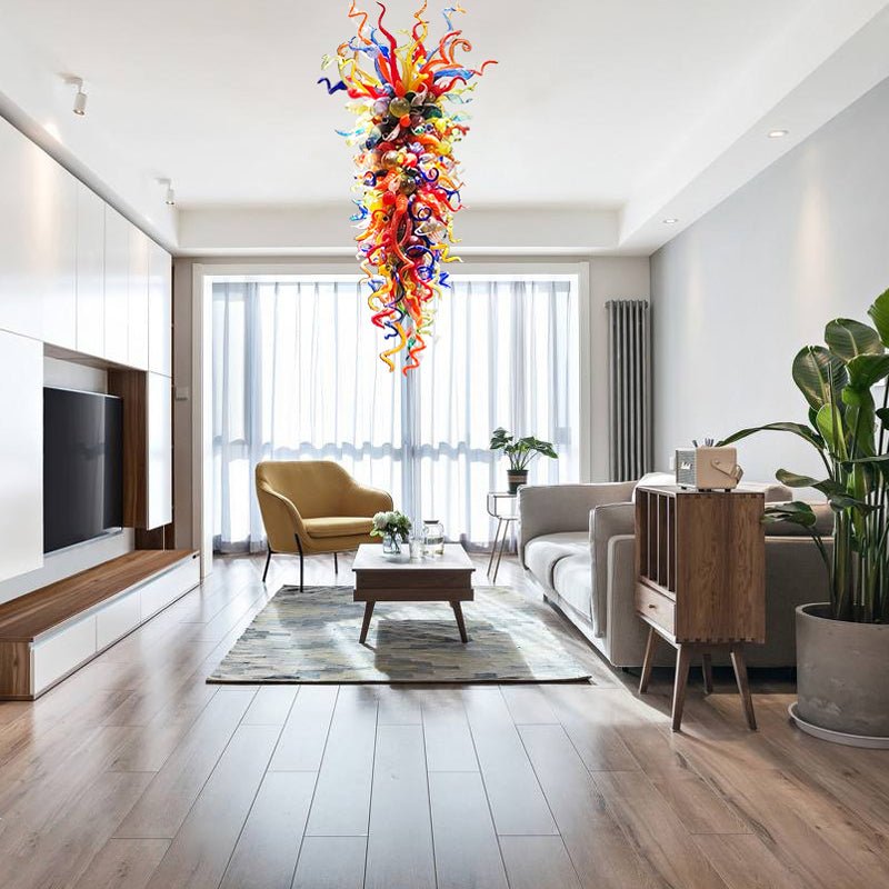 Modern living room with colorful glass sculpture, gray sofa, and wooden coffee table.