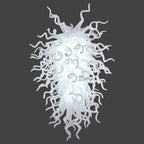 Arctic Frost artisan chandelier featuring a dense cascade of pure white hand-blown glass tendrils illuminated from within.