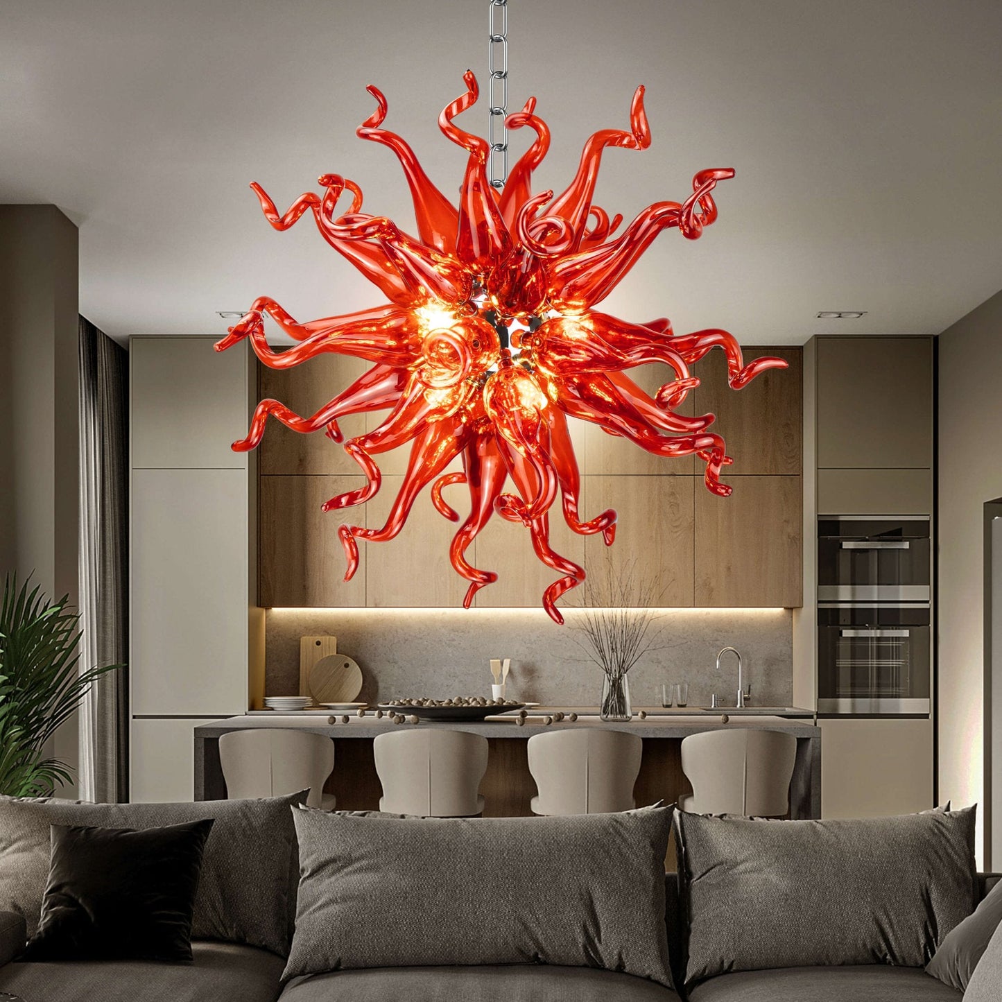 Sculptural crimson glass chandelier acting as a bold artistic centerpiece in a contemporary master bedroom
