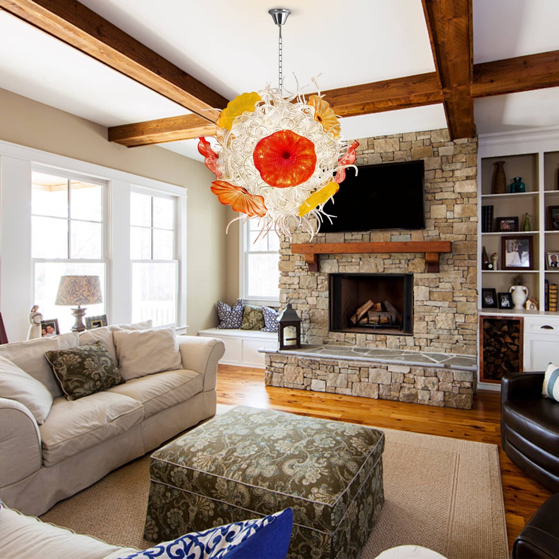 A rustic-modern living room with a stone fireplace, wood beams, and a unique sculptural glass chandelier.