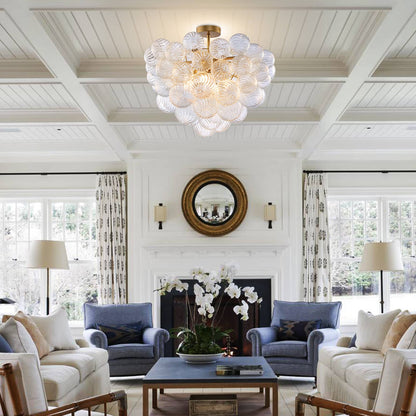 Elegant foyer lighting featuring the Talia inspired semi-flush mount above a classic console table and staircase.