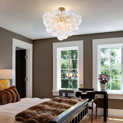 Luxury master bedroom with the ribbed glass bubble light installed on the ceiling, creating a warm and relaxing ambiance.