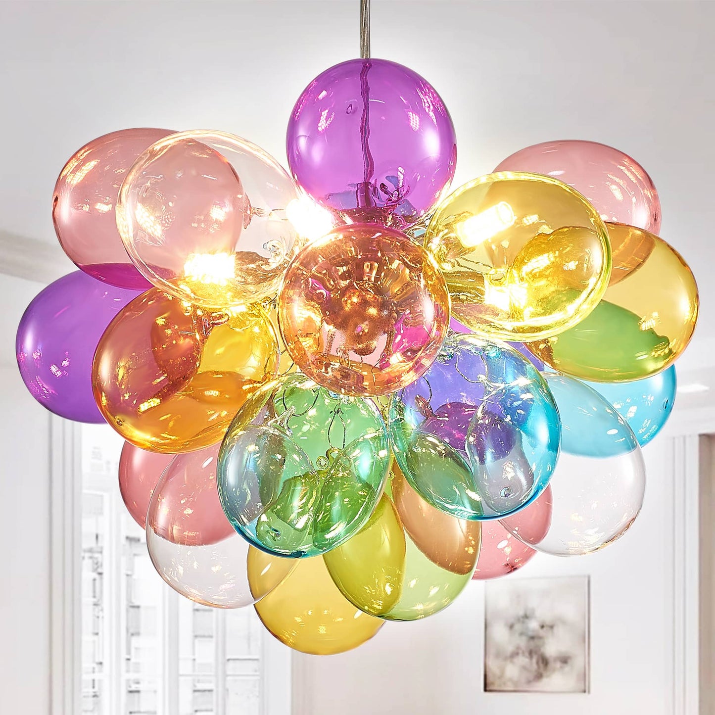 Close-up view of a hand-blown colorful glass balloon chandelier showcasing its vibrant stained glass shades.