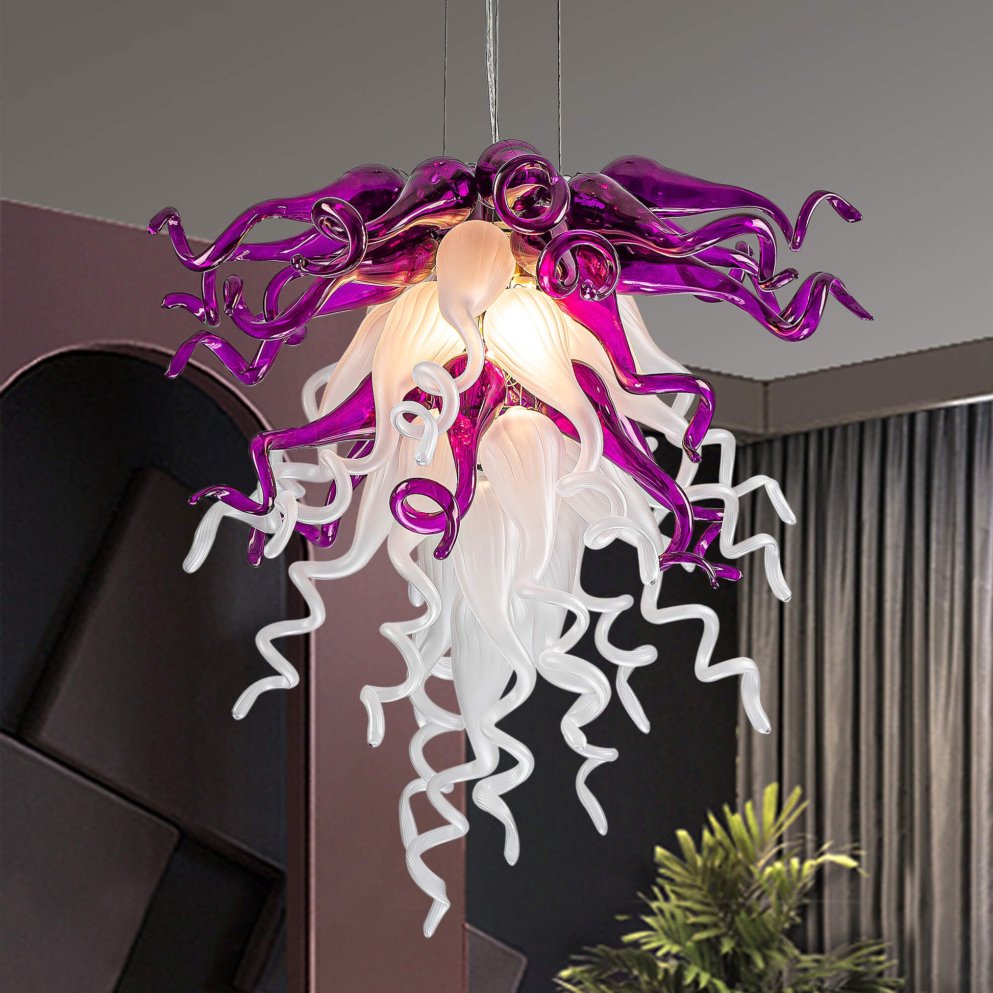 Modern Chihuly chandelier with purple and white design hanging in a room.