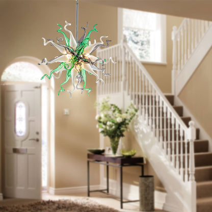 Elegant foyer and staircase lighting featuring a hand-blown glass chandelier in green and gray.