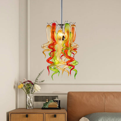 Murano style hand-blown glass pendant light as a vibrant bedside lamp in a modern bedroom.