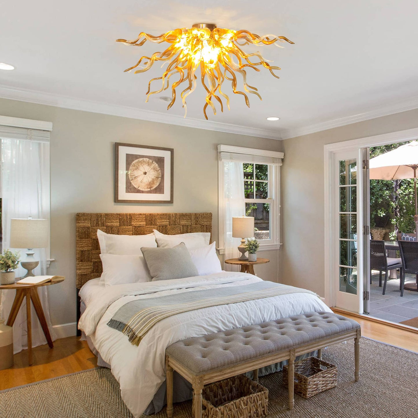 Cozy and bright bedroom interior design showcasing the low-profile glass art pendant light mounted to the ceiling above a beautifully styled bed with neutral-toned linens.