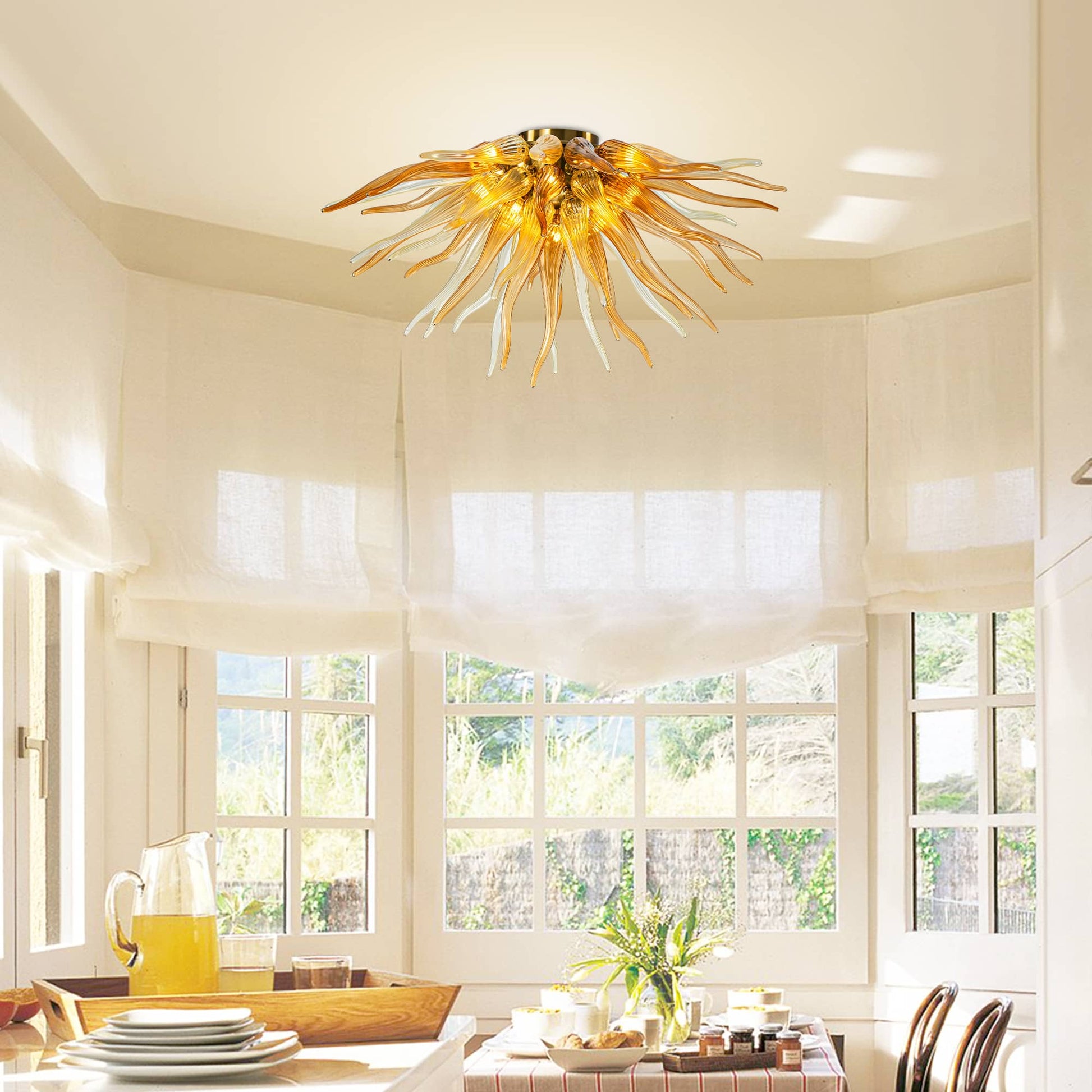 Symmetrical view of a semi-flush amber glass chandelier radiating light in a dark room, creating a sun-like effect.