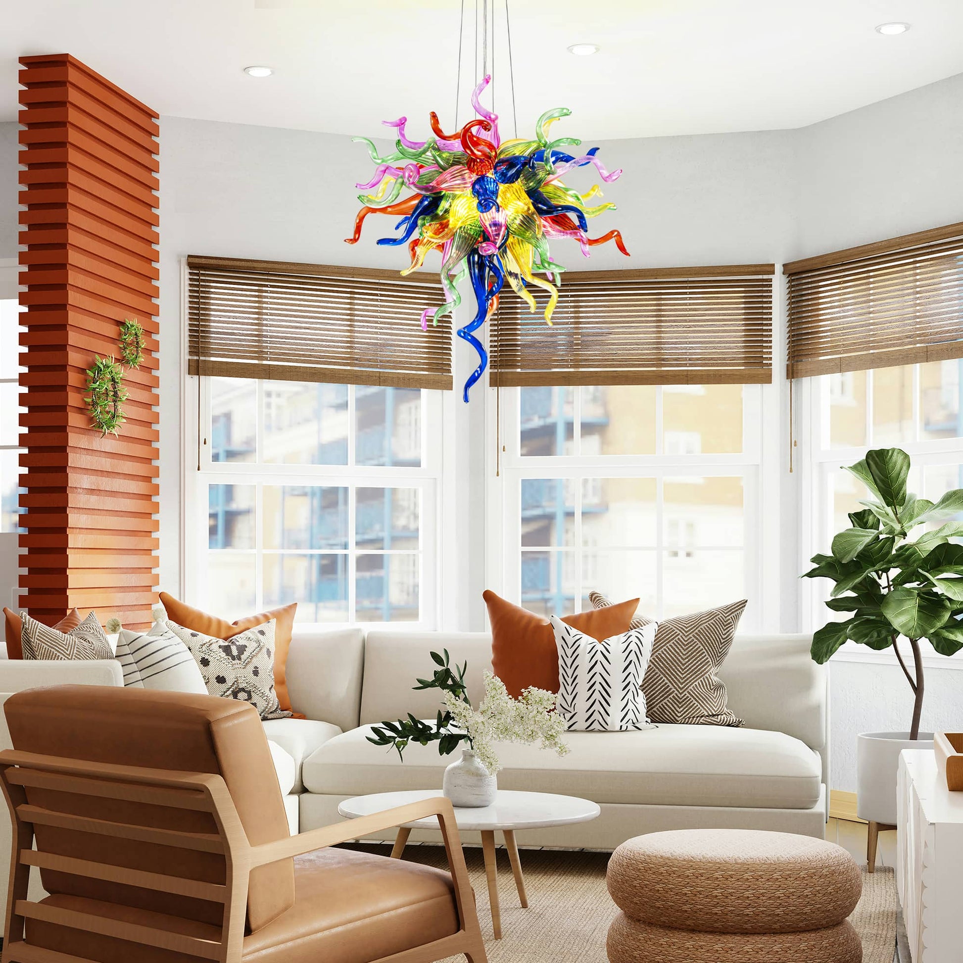 Vibrant art glass pendant light installed in a contemporary living room with large windows and garden views.
