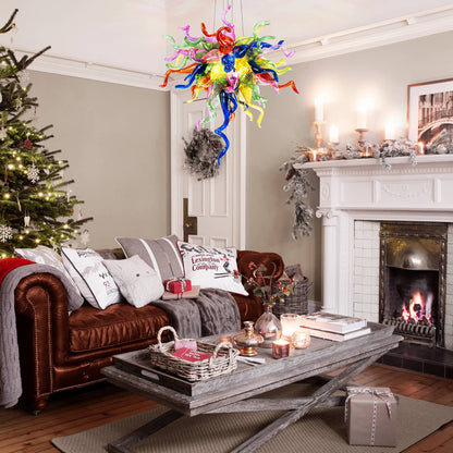Artistic rainbow glass chandelier as a warm accent in a cozy living room with a stone fireplace and Christmas decor.
