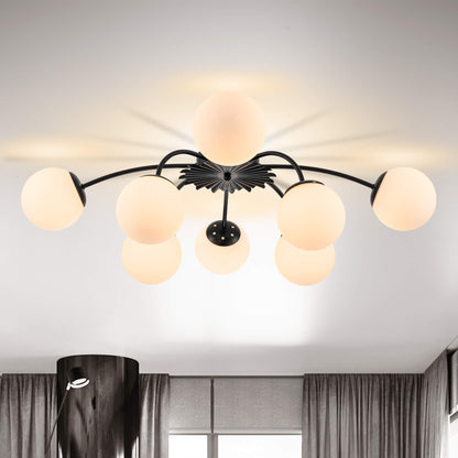 Modern ceiling light fixture with opal frosted glass shades in a room setting