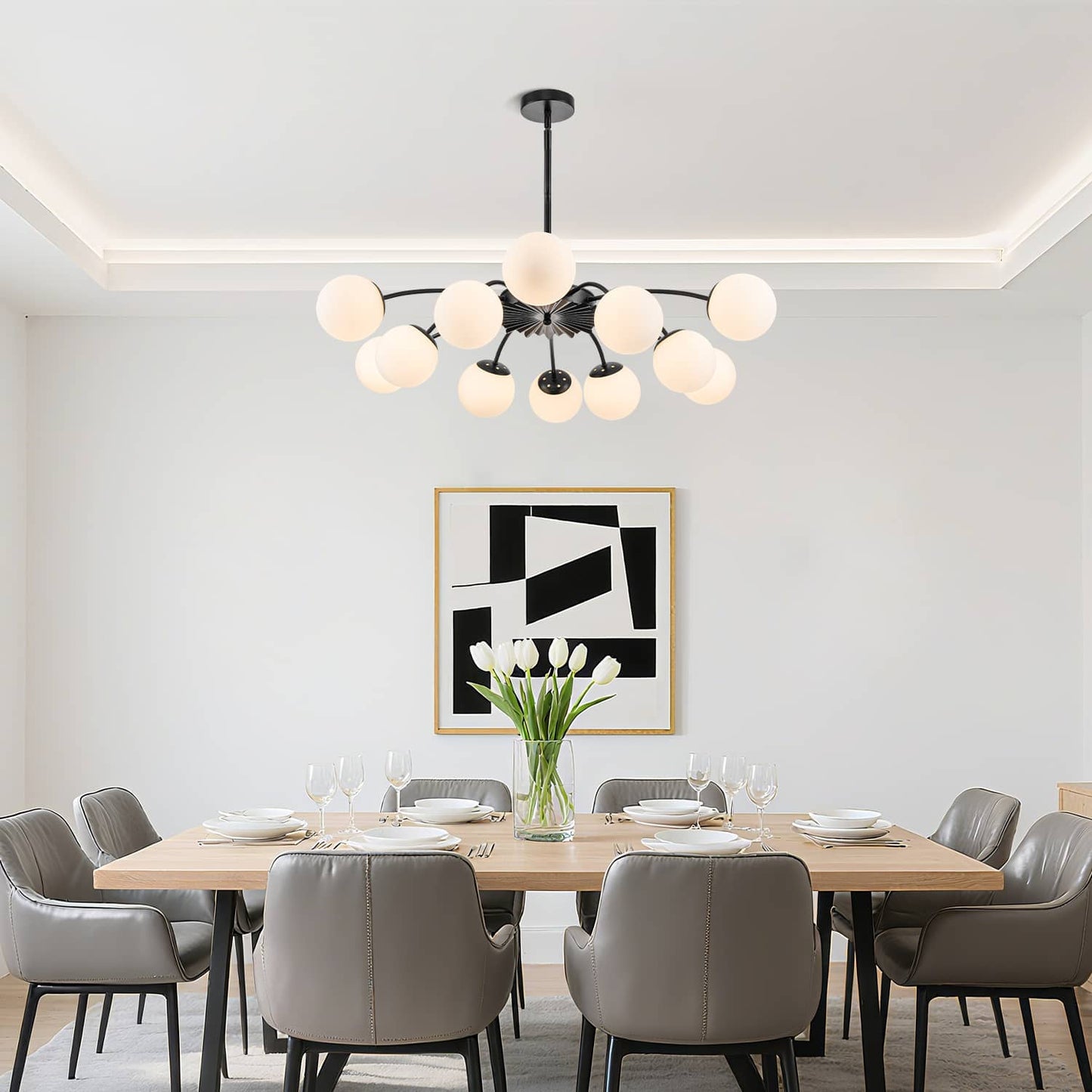 Elegant globe pendant chandelier above modern dining setup