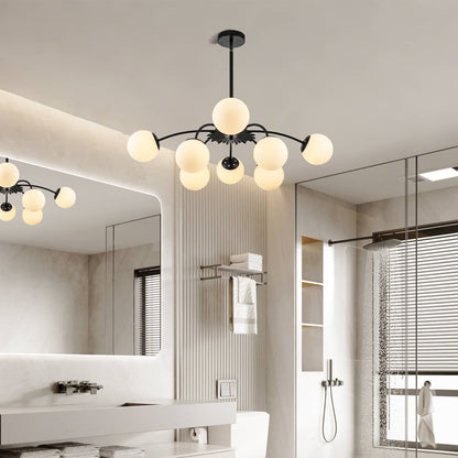 Modern chandelier in a bathroom with mirrors and shower area.