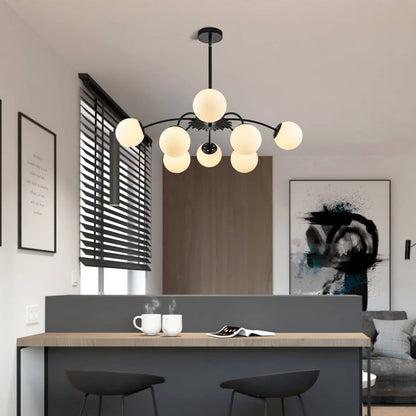 Modern bubbles chandelier hanging above a dining table in a stylish room with abstract art on the wall.