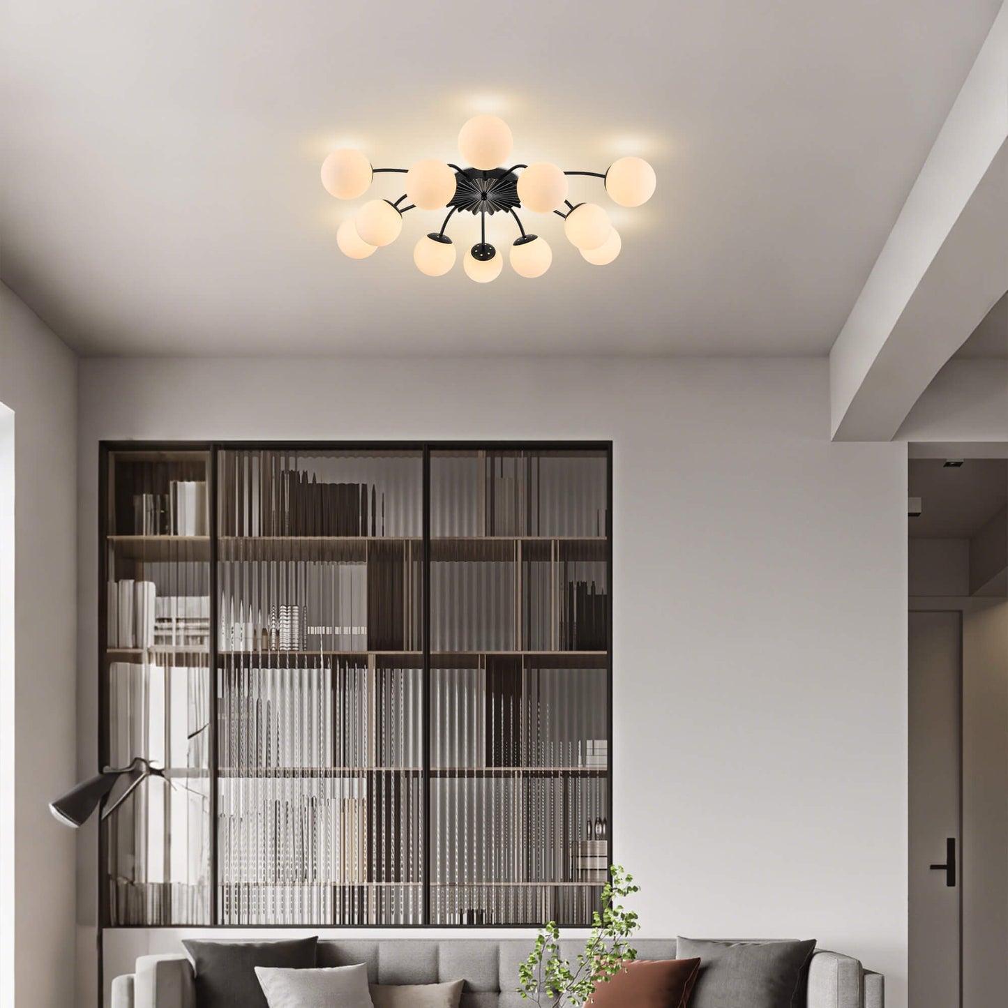 Black modern ceiling light fixture with frosted glass globes in living room