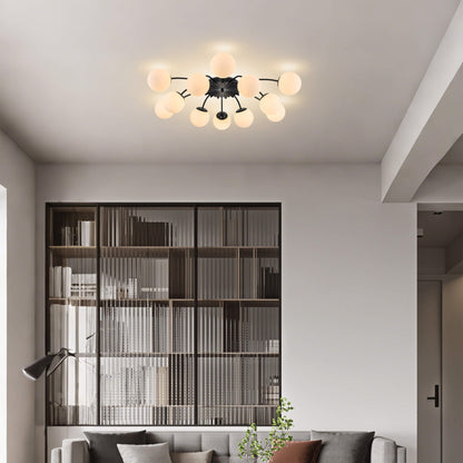 Black modern ceiling light fixture with frosted glass globes in living room