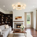 Brass semi-flush mount chandelier illuminating a contemporary living room