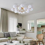 Modern living room with a stylish chandelier, sectional sofa, and coffee table.