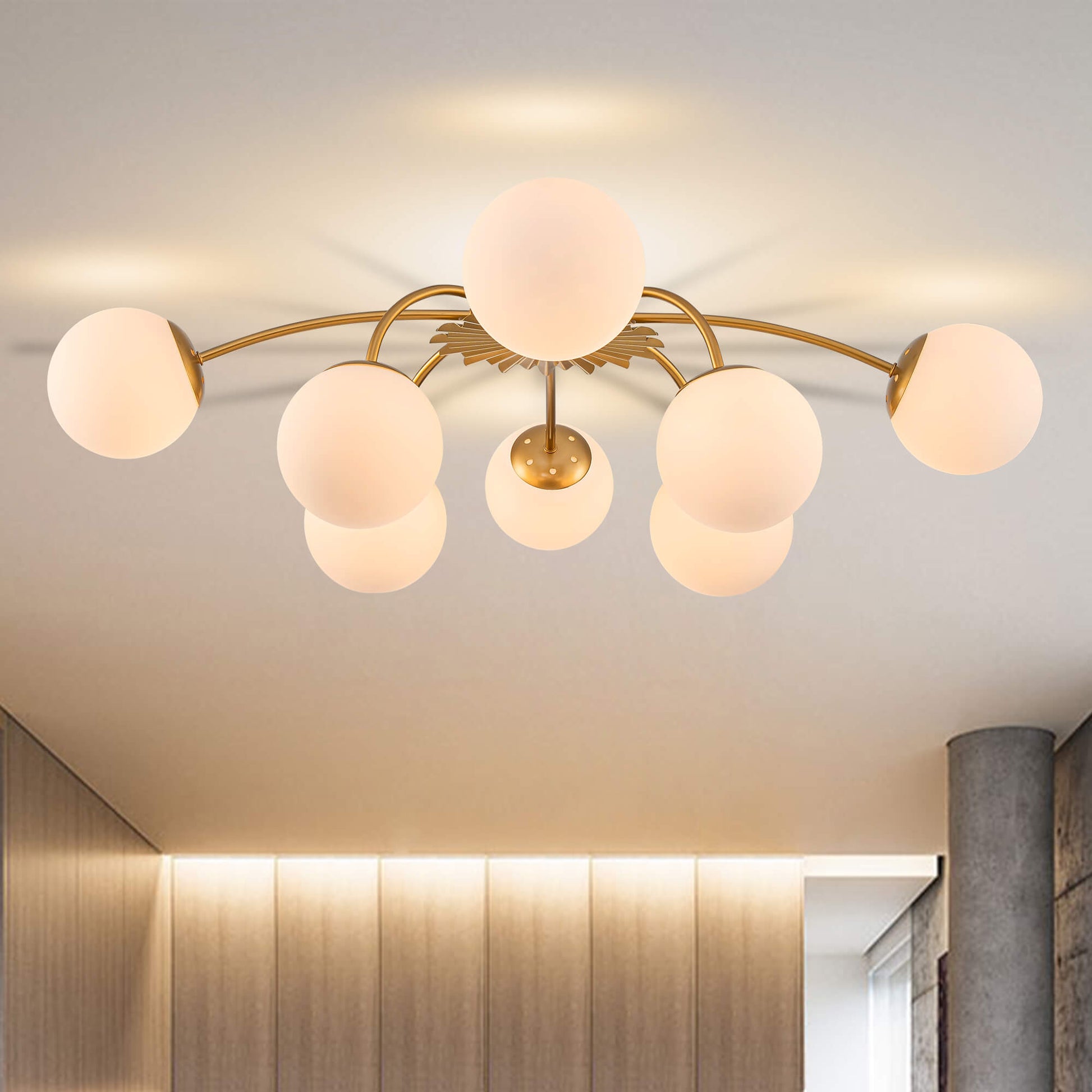 Modern ceiling light fixture with glass shades in a room setting