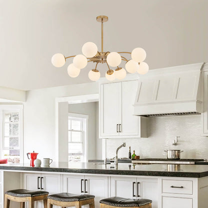Elegant globe pendant chandelier above modern dining setup and kitchen island