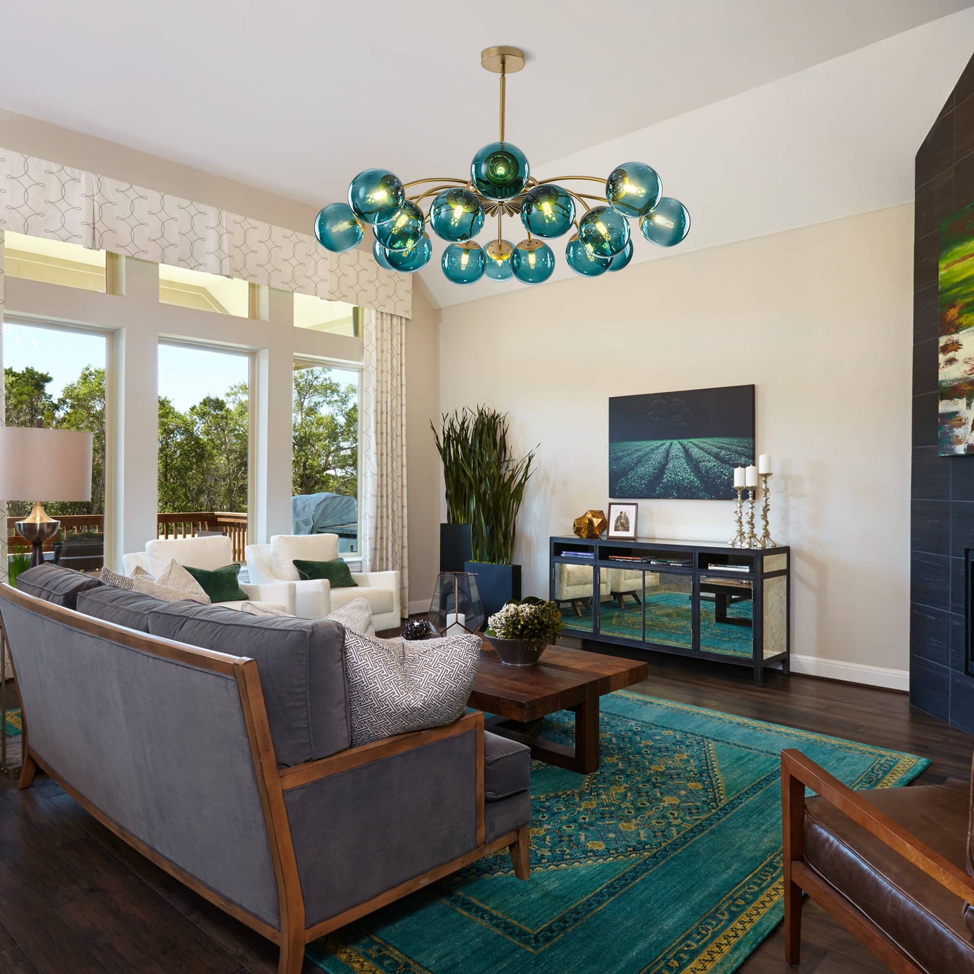 Brass globe chandelier with teal blue glass shades in living room