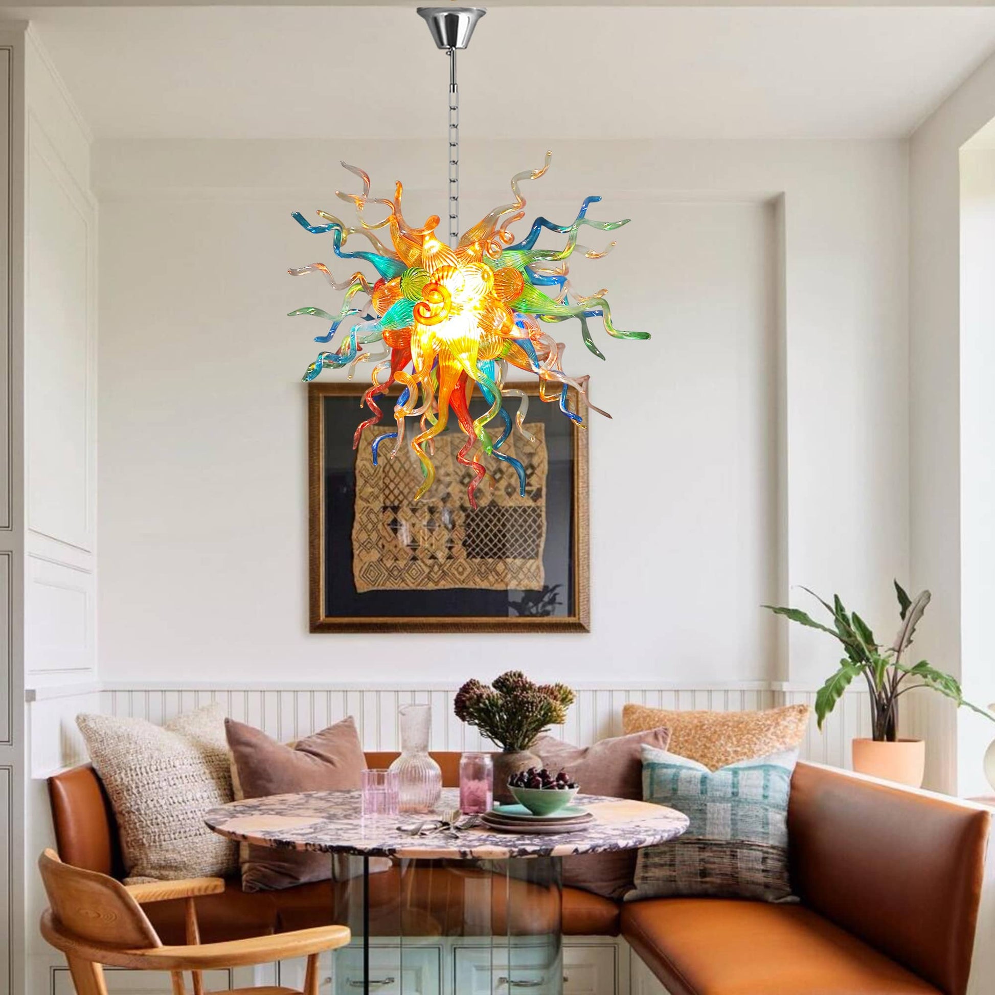 Creative office space featuring a multi-color glass sculptural pendant light above a designer seating area.