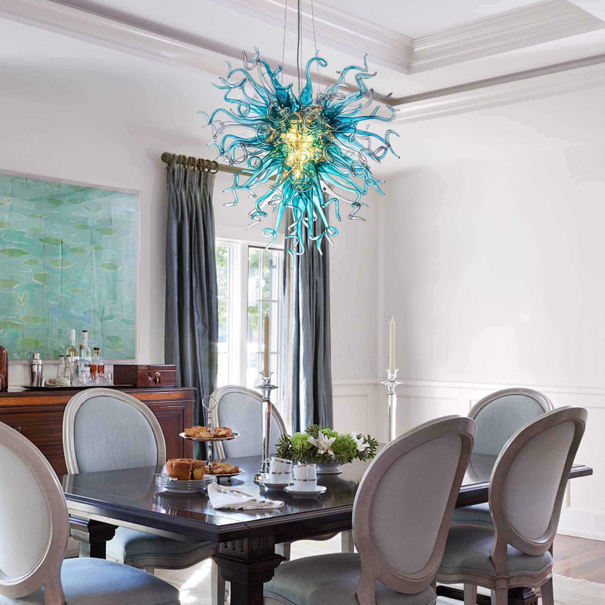 Bespoke glass art lighting fixture illuminating a formal dining room with elegant gray chairs.