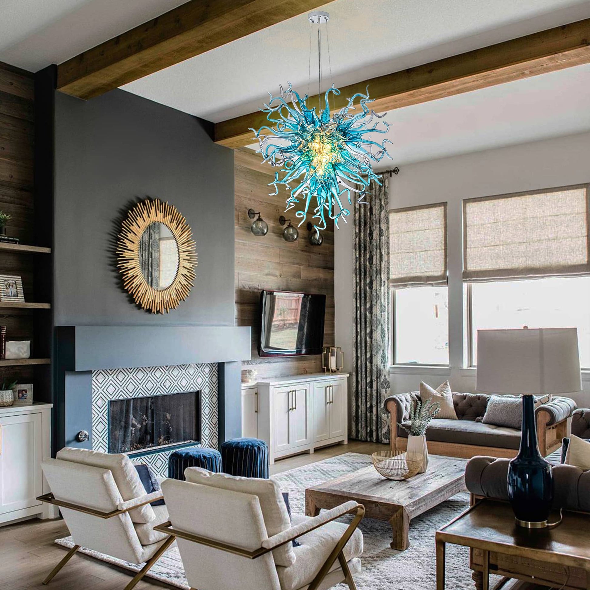 Mouth-blown art glass chandelier complementing a sophisticated living space with a classic fireplace.