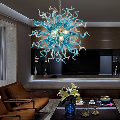 Modern luxury living room featuring a blue art glass chandelier as a central ceiling focal point above a coffee table.