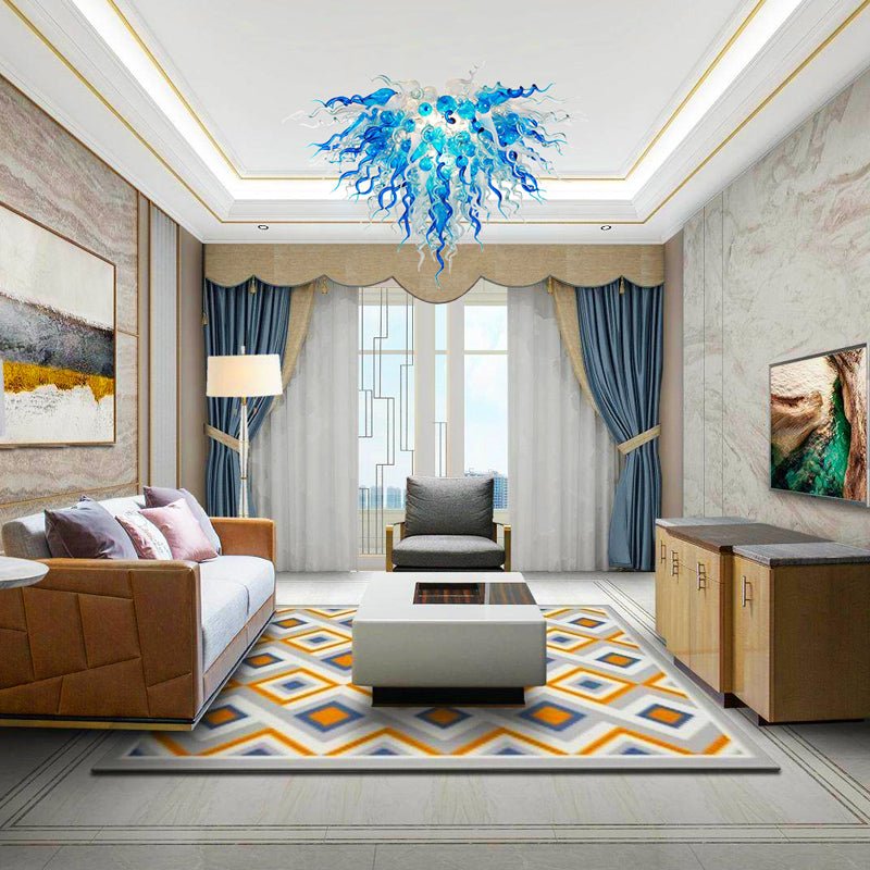 Modern luxury living room featuring a blue and clear glass sculptural chandelier as a central ceiling art statement.