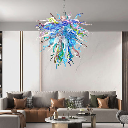 Sophisticated lounge with brown leather sofas, showcasing the dramatic scale of the celestial-themed artisan glass chandelier.