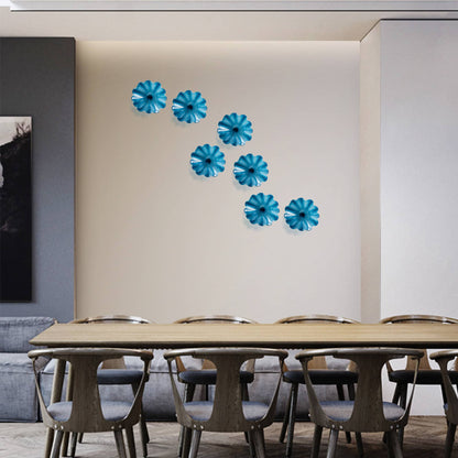 Symmetric cluster of five Azure Blue hand-blown glass plates as a focus feature above a contemporary wooden dining table.