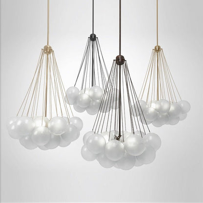 Four frosted glass globe pendants in gold and black finishes showcasing different cluster sizes.