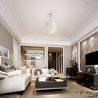 Luxury open-plan living room with white sofas and clean lines, showcasing the elegant silhouette of a frosted white art light.