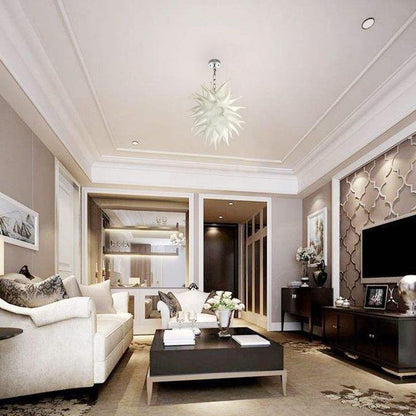 Luxury open-plan living room with white sofas and clean lines, showcasing the elegant silhouette of a frosted white art light.