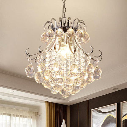 Light refraction through precision-cut crystal pendants of a luxury modern chandelier.