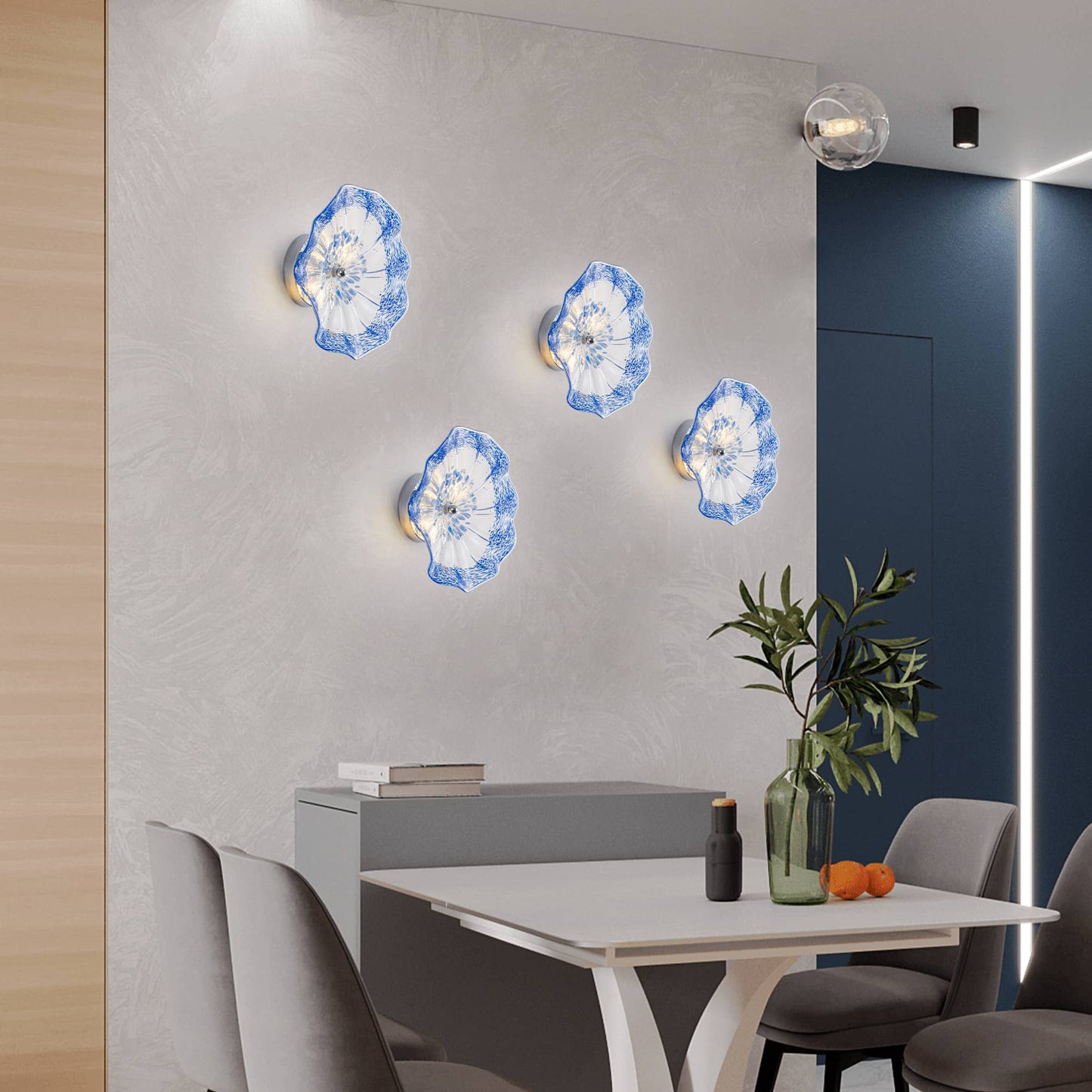 Round cobalt blue flower-shaped blown glass wall sconce showing unique spotted patterns.