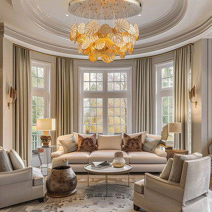 Modern luxury chandelier featuring layered, golden monstera leaves.
