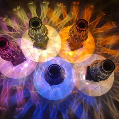 Colorful rechargeable crystal lamps in purple, blue, and amber for bedside atmosphere.