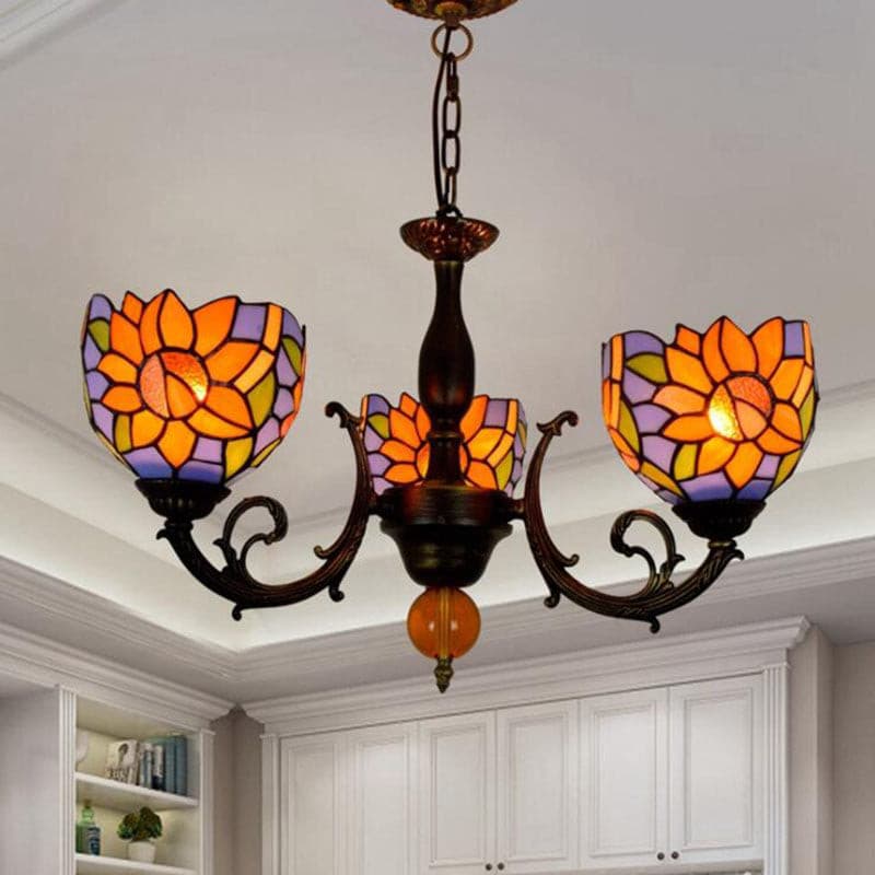Handcrafted floral stained glass lamp shades featuring orange sunflower design on a vintage metal frame.
