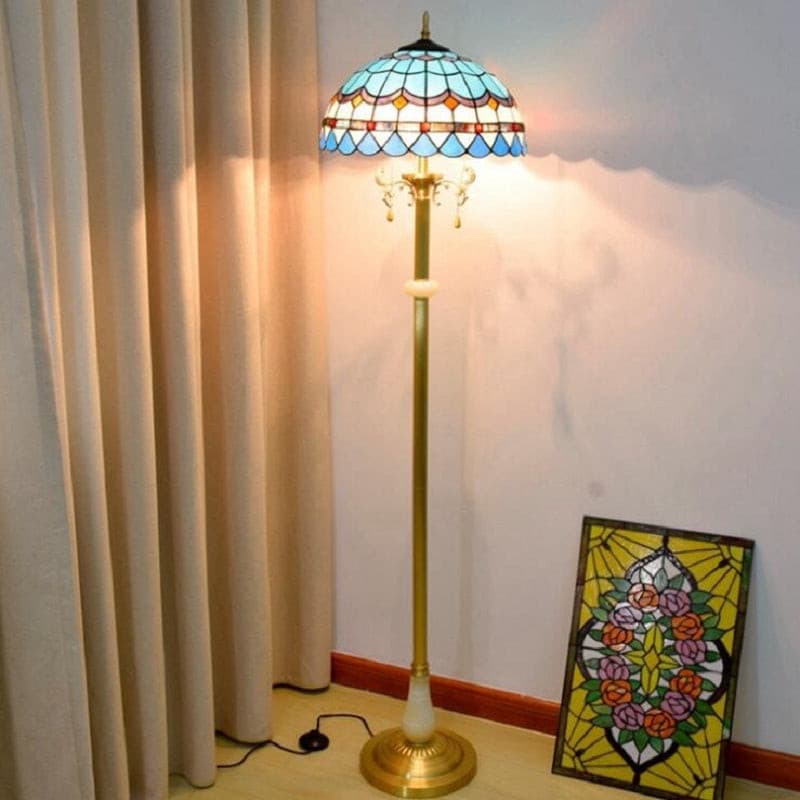 Vintage blue stained glass standing lamp with antique brass base