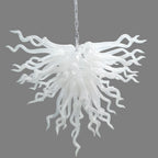 Serene Waterfall artisan glass chandelier featuring a dense cluster of hand-blown white glass spirals hanging from a metal chain