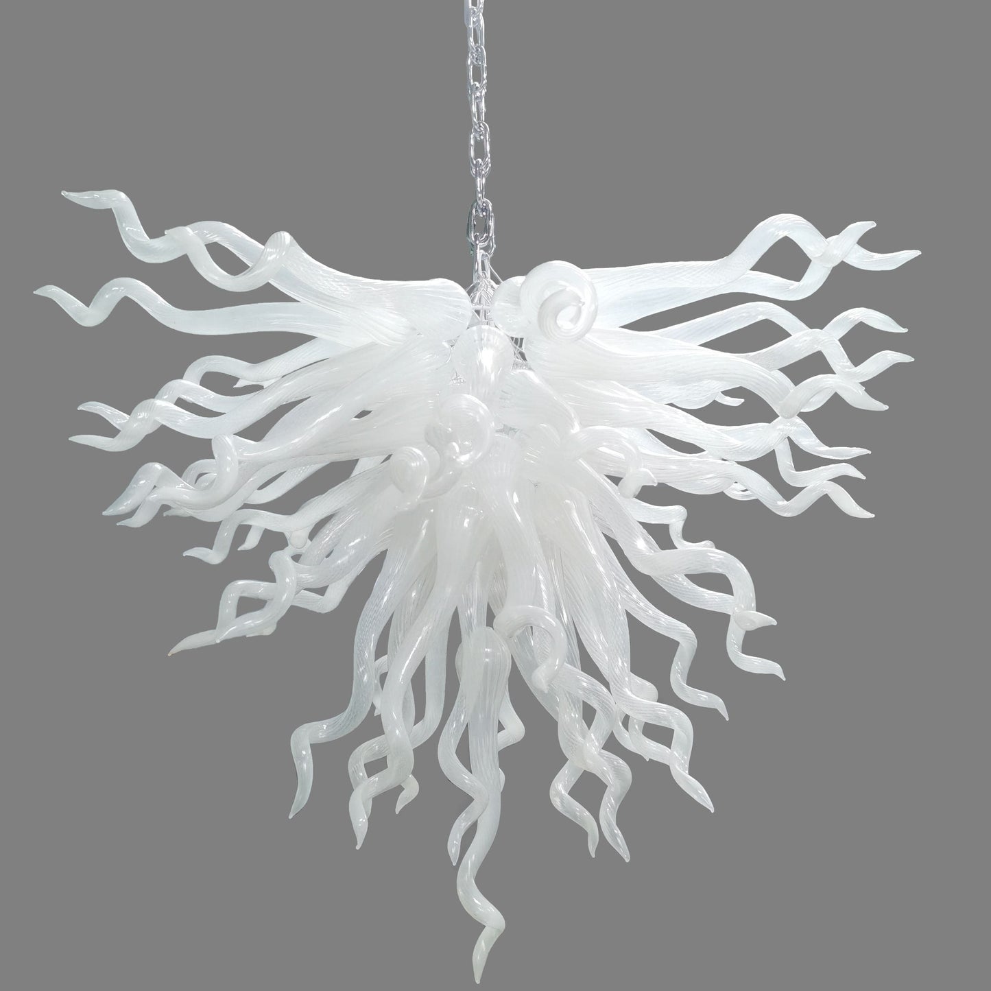 Serene Waterfall artisan glass chandelier featuring a dense cluster of hand-blown white glass spirals hanging from a metal chain