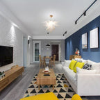 Modern open-plan living space with minimalist wooden decor, illuminated by a radiant white Arctic Petal artisan pendant light.
