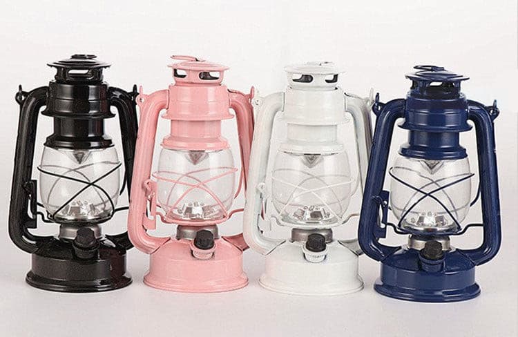 Collection of vintage horse lanterns in pastel pink, white, and navy blue colors.