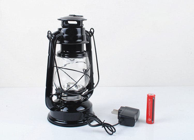 Modern black vintage LED lantern with rechargeable battery and charging cable.