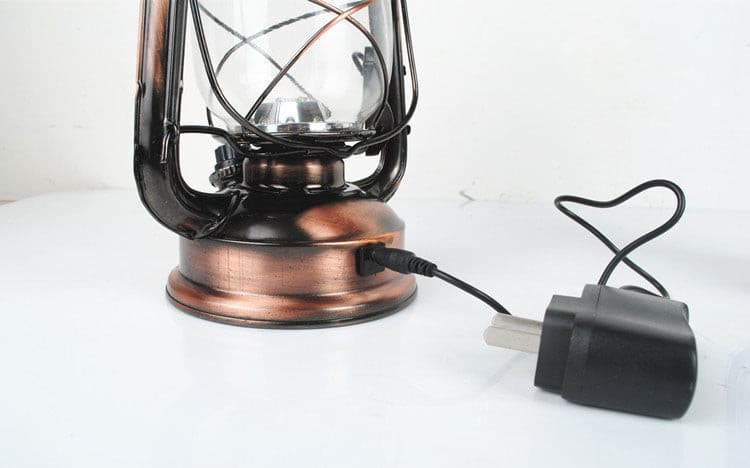 Portable vintage-style horse lantern showing USB charging port and power adapter.